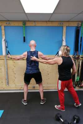 Personal Trainer Clint with Client - Elite Training Facility