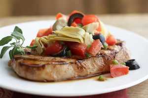 Grilled Pork Chops with Mediterranean Style Toppings by Elite Training Facility